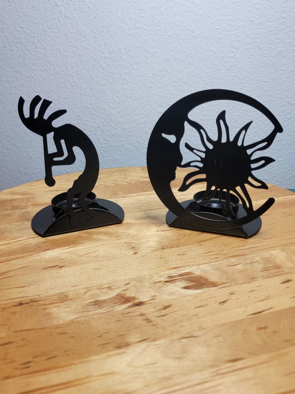 The Southwest Kokopelli Decorative Cast Iron Candle Holders are handmade in the